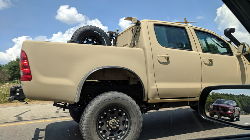 Illustration for article titled Check Out This Militarized Toyota Hilux and Its Weird Door Handles